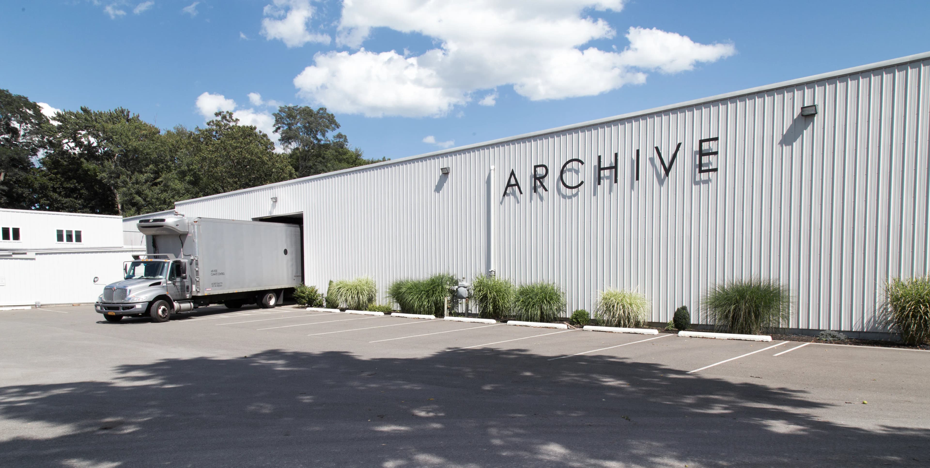 Archive Fine Art facility exterior with truck at loading dock